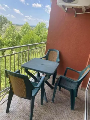 a table and chairs sitting on a balcony at Family, Friendly 2 Bed Apartment in Sunny Beach