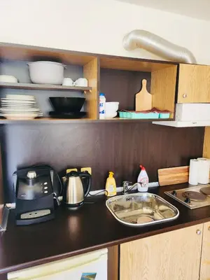 a kitchen counter with a sink and a microwave at ANDALUSIA BEACH A602 Elenite in Burgas City