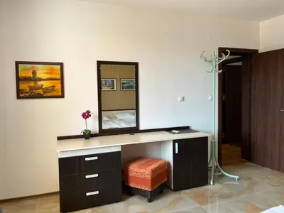 a bathroom with a vanity with a mirror at Apart di Landi in Ravda