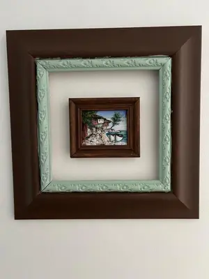 a picture of a painting in a frame on a wall at Apart di Landi in Ravda
