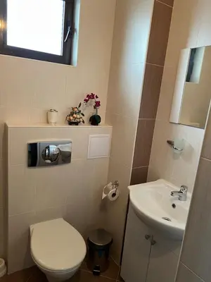 a bathroom with a toilet and a sink at Apart di Landi in Ravda