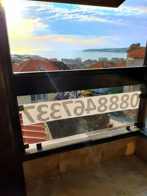 a view from a window with a view of a building at Стая за гости - 1 in Sozopol