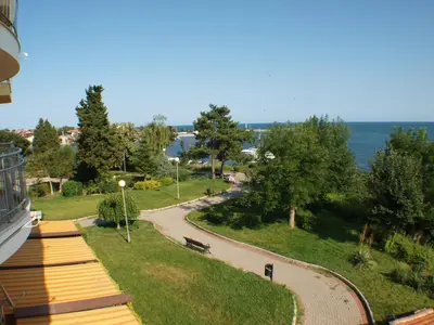 a view of a park with a bench and a path at Nessebar View Apartament in Nesebar
