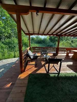 a pavilion with two chairs and a bench on a patio at Вила Бонита плаж Градина in Burgas City
