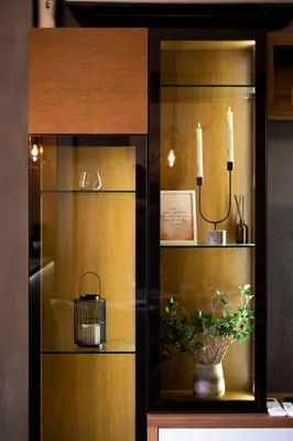 a glass cabinet with a potted plant and candles at KIM Centre in Burgas City