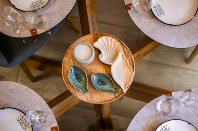 a wooden plate with eggs and shells on a table at KIM Centre in Burgas City