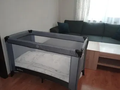 a bed in a living room with a couch at Masada in Burgas City