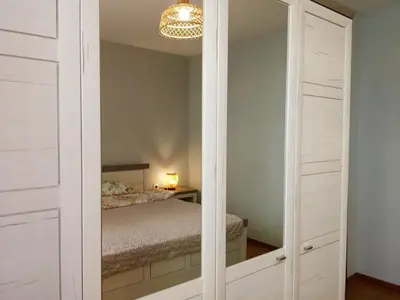 a closet with a mirror in a bedroom at Masada in Burgas City