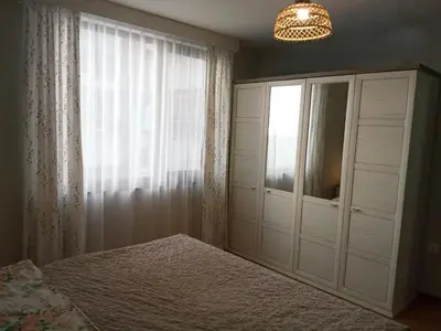 a bedroom with a bed and a window at Masada in Burgas City