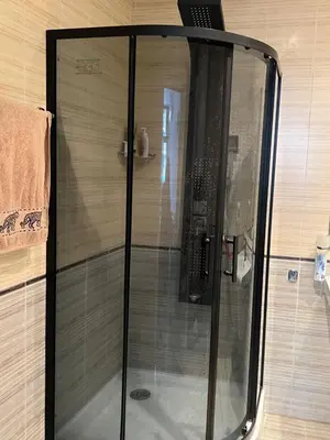 a shower with a glass door in a bathroom at Hotel Grenada in Sunny Beach