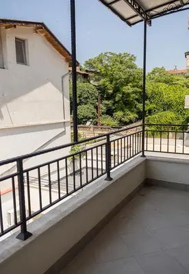 a balcony with a view of a building at Exclusive Central Varna Apartment - 2 Beds and Parking by Flat Mаnаger in Varna City