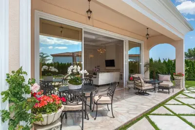 an outdoor patio with a table and chairs at Villa Dolce Vita in Sunny Beach