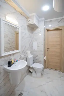 a white bathroom with a sink and a toilet at Marea Garden, Ravda - 1BD Apartment with Pool by Flat Mаnager in Ravda