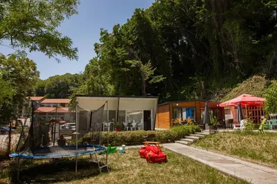 a home with a tent and a trampoline in the yard at Къмпинг- бунгала Албатрос in Varna City