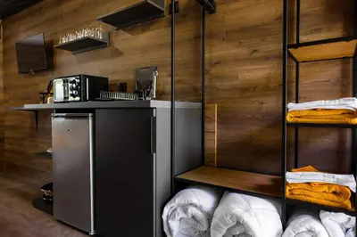 a room with a kitchen with a counter with towels at Къмпинг- бунгала Албатрос in Varna City