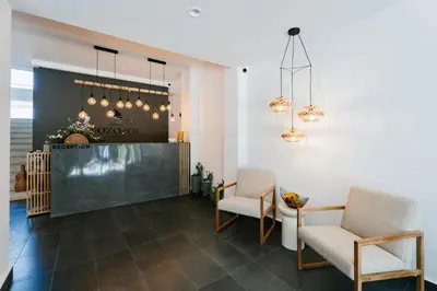 a lobby with two chairs and a counter at Hotel Sozopol 99 in Sozopol