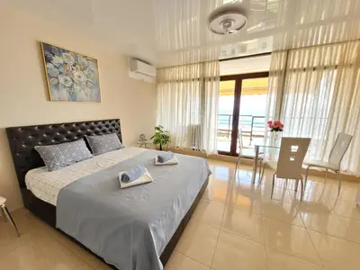 a bedroom with a large bed with two towels on it at Dolce Vita 1 Ap-6 in Sveti Vlas
