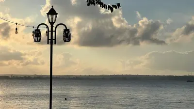 a street light next to a body of water at Summer Mood, Forest Feeling in Sozopol in Sozopol
