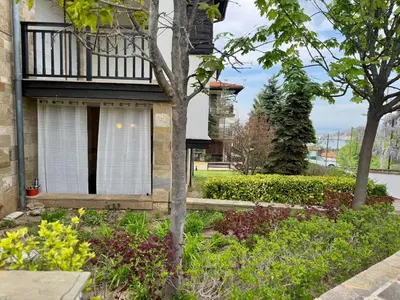 a house with a window and a balcony at Apartment at the Seaside in Sozopol