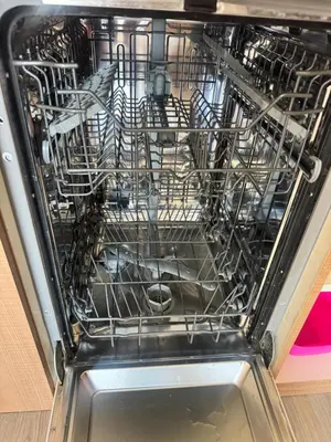 a dishwasher filled with lots of dishes at Downtown Harmony Chill Place in Varna City