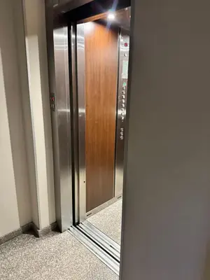 a reflection of a elevator door in a mirror at Downtown Harmony Chill Place in Varna City