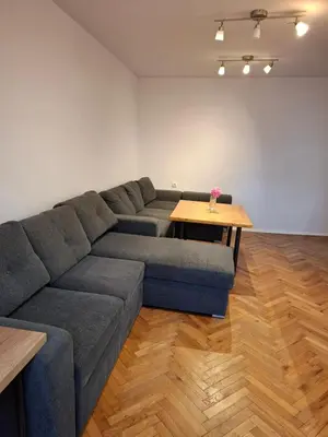 a living room with a couch and a table at Accommodation apartment MARGARITA in Burgas City