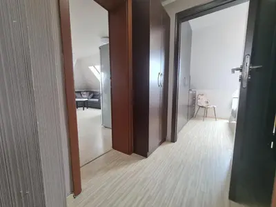 a hallway with an open door to a room at 