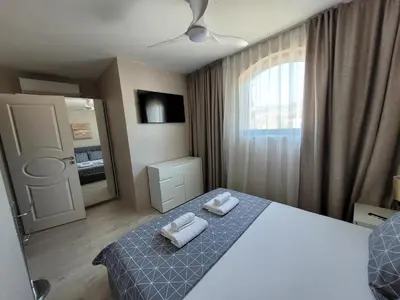 a bedroom with a bed with two towels on it at Millenium II B34 in Sveti Vlas