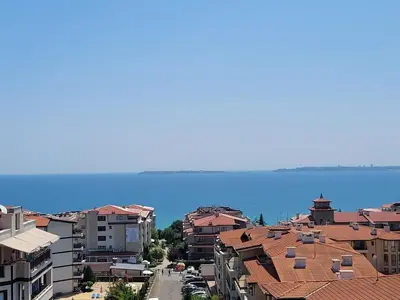 a city with buildings and the ocean in the background at Millenium II B34 in Sveti Vlas