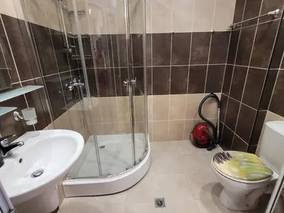 a bathroom with a shower and a toilet and a sink at Royal Palm 170 in Sveti Vlas