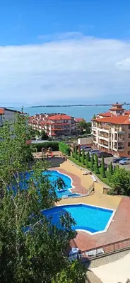 a view of a resort with two pools and a beach at Royal Palm 170 in Sveti Vlas