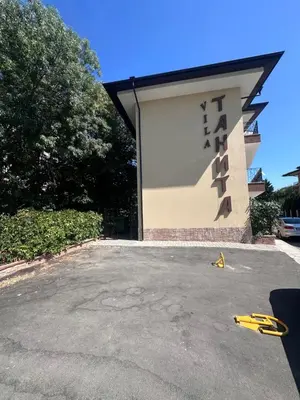 a building with a sign on the side of it at Villa Tanita in Ravda