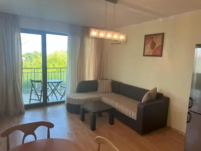 a living room with a couch and a table at Appart complex - Egrek 6 in Lozenets