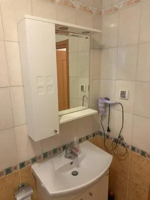 a bathroom with a white sink and a mirror at Appart complex - Egrek 6 in Lozenets