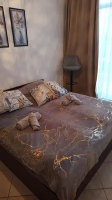 a large bed in a bedroom with at Grand Kamelia C1 in Sunny Beach