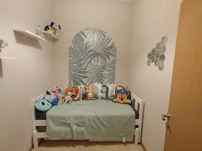 a bed with stuffed animals on it in a room at Grand Kamelia C1 in Sunny Beach