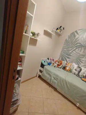 a bedroom with a bed with stuffed animals on it at Grand Kamelia C1 in Sunny Beach