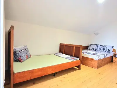two bunk beds in a room with wooden floors at Relax & Spa-House near Therma Numera in Burgas City