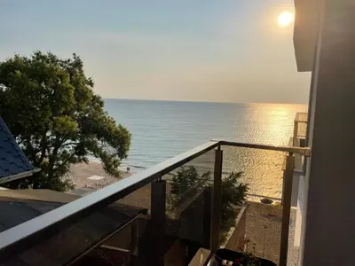 a view of the ocean from the balcony of a house at Apartment Bela in Obzor