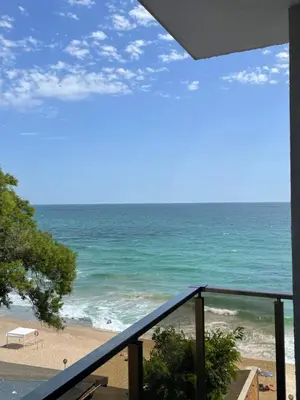 a view of the beach from a balcony at Apartment Bela in Obzor