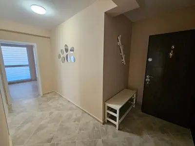 a room with a door and a bench next to a door at Апартаменти Кастро2-Castro Apartments2 in Tsarevo