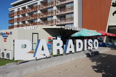 a large sign in front of a building at PARADISO B 410 Studio with SEA VIEW in Nesebar