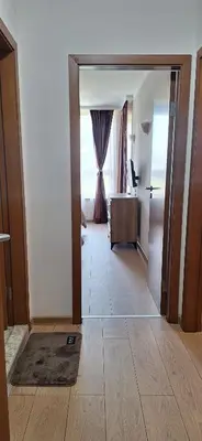 a room with a door open to a living room at Royal Dreams apartments - 2 in Sunny Beach