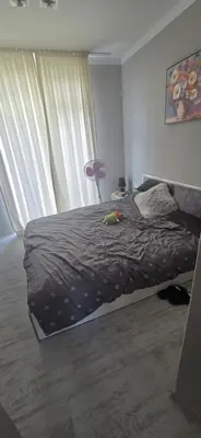 a bedroom with a bed and a large window at New 3Room Maisonette Apartment in Sunny Day 3 Sunny Beach in Sunny Beach