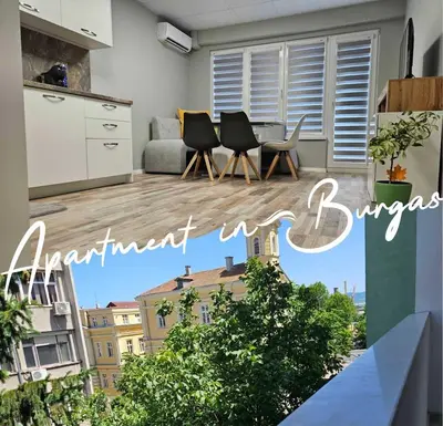 an apartment with a kitchen and a living room at Central Flat, Close to the beach in Burgas City
