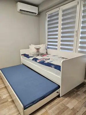 a small bedroom with a bed and a window at Central Flat, Close to the beach in Burgas City