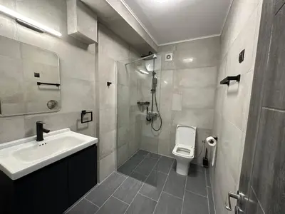 a bathroom with a sink and a toilet at Sozopol Beach Apartments in Sozopol