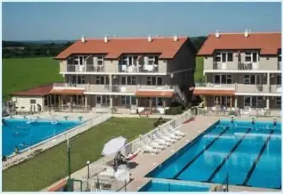 a large building with a large swimming pool at ВС Морски дюни in Shkorpilovtsi