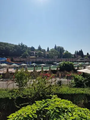 a garden with bushes and flowers in a park at Villa Astoria 2 - Premium Apartments in Elenite
