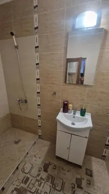 a bathroom with a sink and a shower at One bedroom studio in Chernomorets